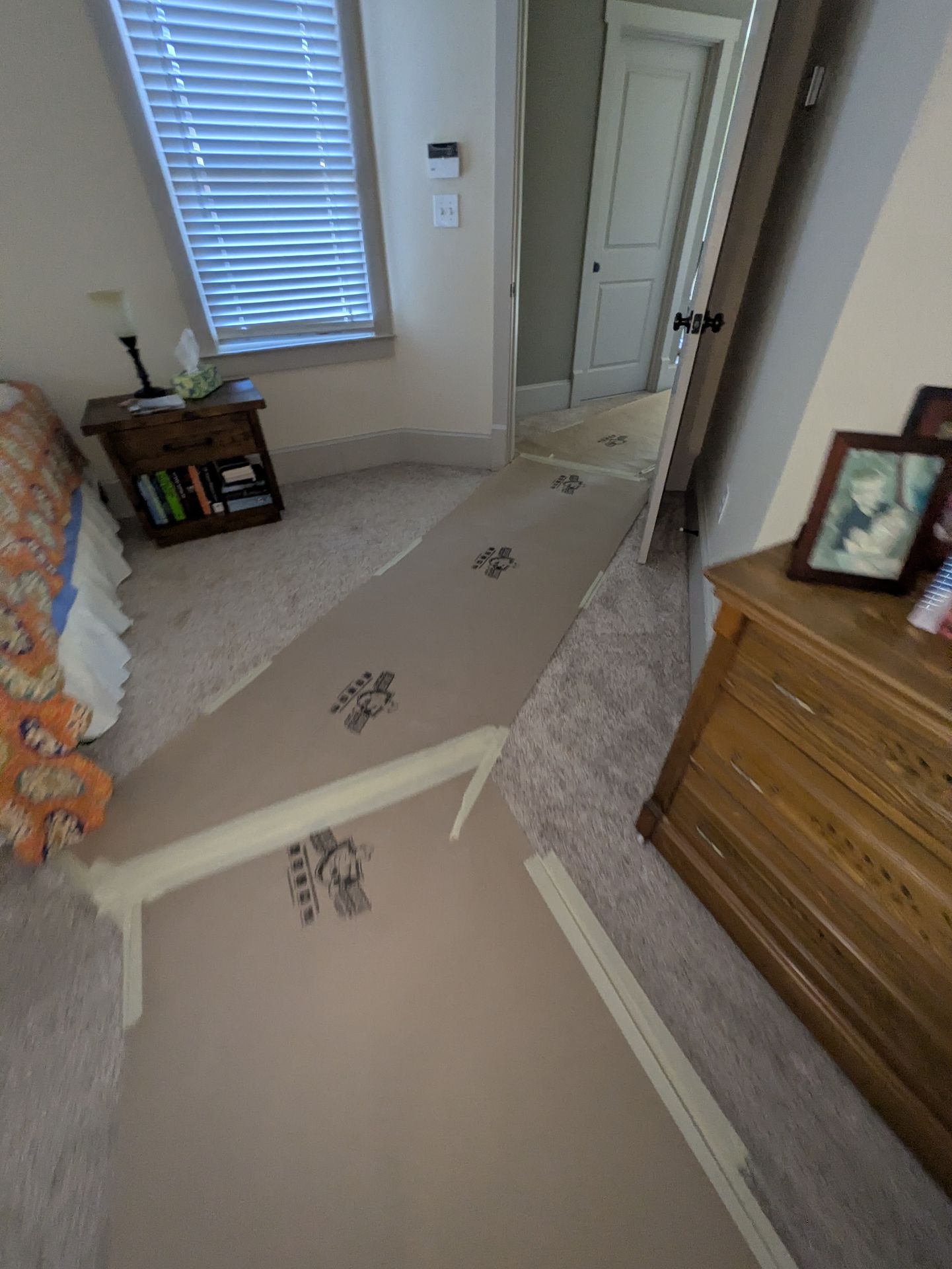 Protected walkway through an Athens cottage during a bathroom gut